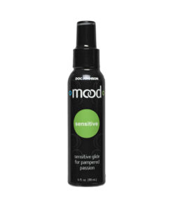 Doc Johnson Mood Sensitive Lube 4oz bottle beside a folded towel on a bathroom vanity