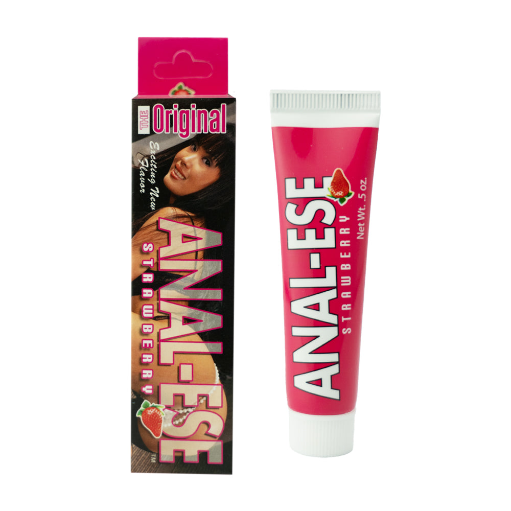 Anal-Ese strawberry desensitizing cream 0.5 oz tube beside a strawberry