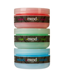 Mood Arousal Gels 3 Pack with Tingle Warm Intensify bottles on a nightstand