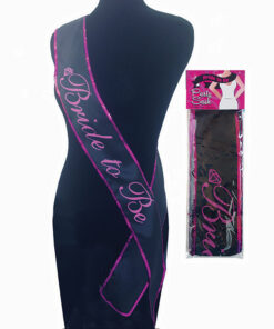 Bride To Be Sash sparkling silver glitter with safety pin draped on white chair at bridal shower.