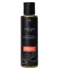 Sensuva Me and You pheromone-infused massage oil bottle with passion fruit guava label and silk fabric