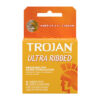 Three Trojan Ultra Ribbed Lubricated Condoms with visible embossed ribbing on a clean white background