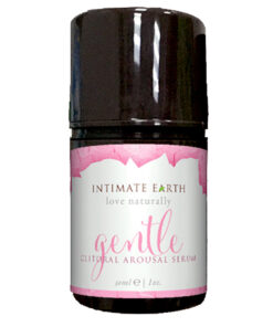 Intimate Earth Gentle Clitoral Arousal Serum 1 oz bottle on a soft pink backdrop with a pebble-shaped vibrator.
