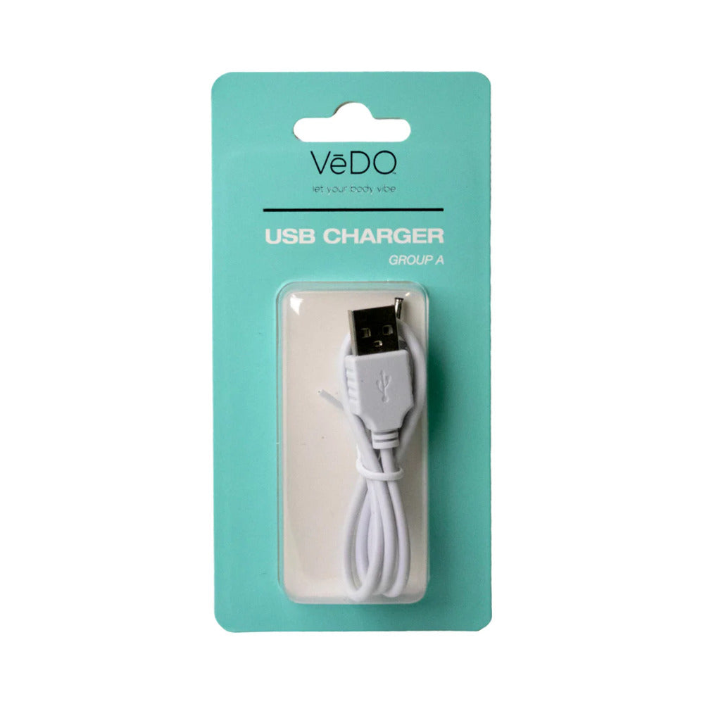 VeDO USB Charger A with magnetic connector on white background next to a VeDO Bam toy.