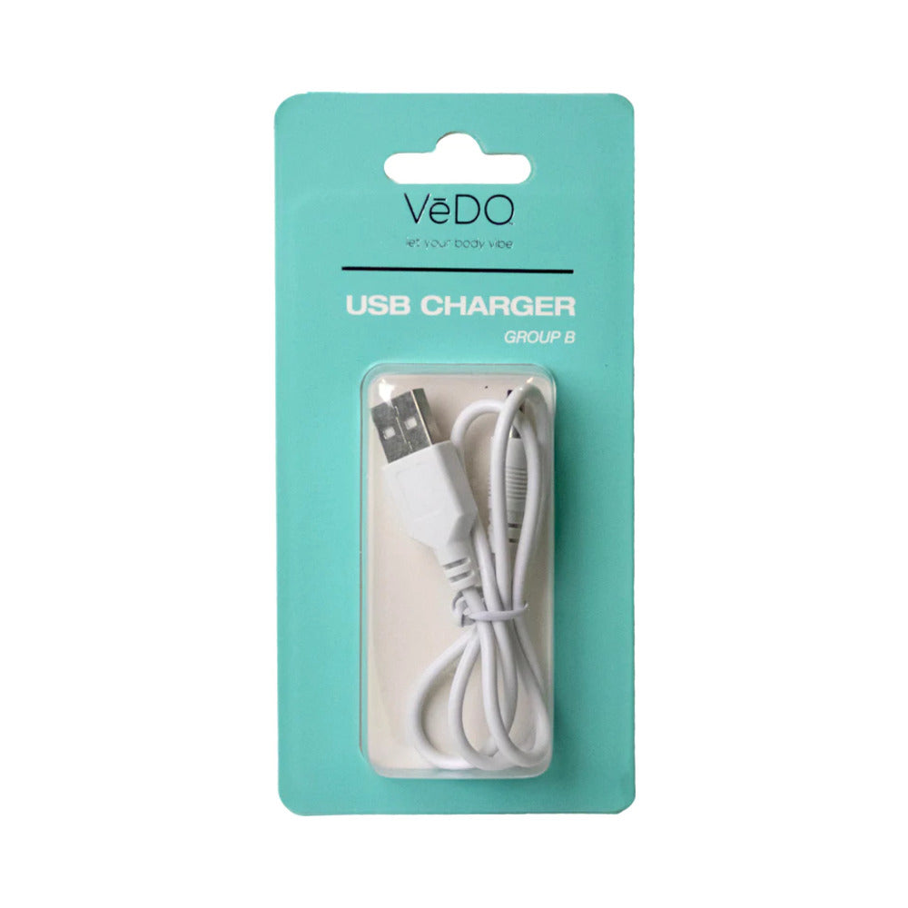 VeDO USB Charger B magnetic cable next to a pink VeDO personal massager