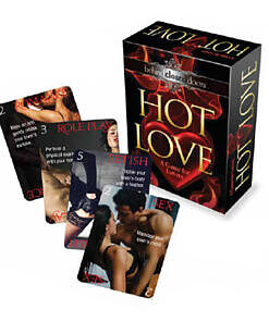 Hot Love Game card deck and box on a bed with rose petals