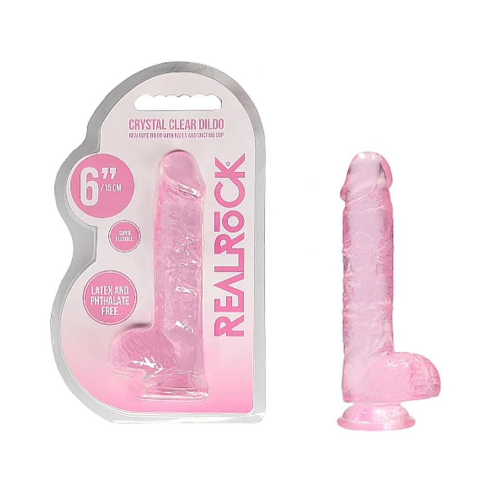 RealRock Crystal Clear Realistic 6 inch pink dildo with balls and suction cup on a white background.