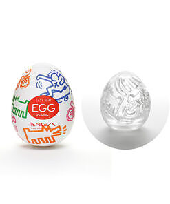 Tenga Keith Haring Egg - Street sleeve shown beside its egg case