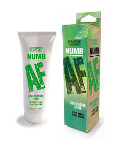Numb AF Spearmint Anal Numbing Cream 1.5 oz tube beside fresh spearmint leaves on a clean surface.