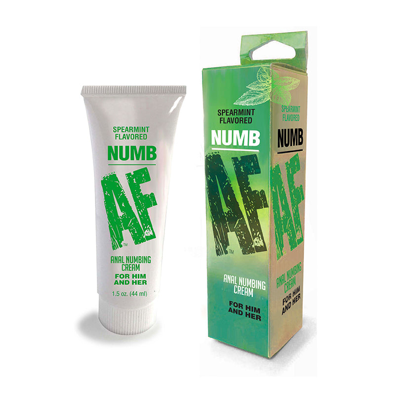 Numb AF Spearmint Anal Numbing Cream 1.5 oz tube beside fresh spearmint leaves on a clean surface.