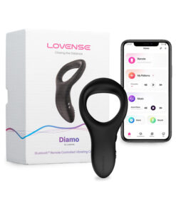 Lovense Diamo Bluetooth Vibrating Cockring in black silicone placed on a bed next to a smartphone showing the Lovense app.