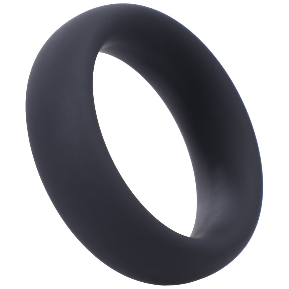 Tantus Intermediate C-Ring in onyx black silicone resting on a clean white surface