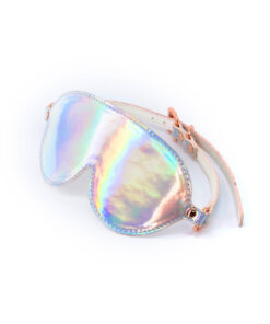 holographic rainbow sheen and rose gold buckle visible.