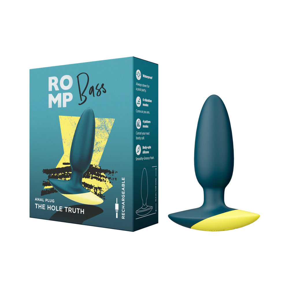 ROMP Bass Rechargeable Silicone Vibrating Anal Plug in dark green with magnetic charging cable against a clean background.