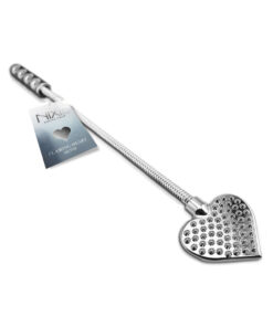 Nixie Metal Riding Crop Flaming Heart with flexible metal shaft and weighted heart tip against black backdrop.