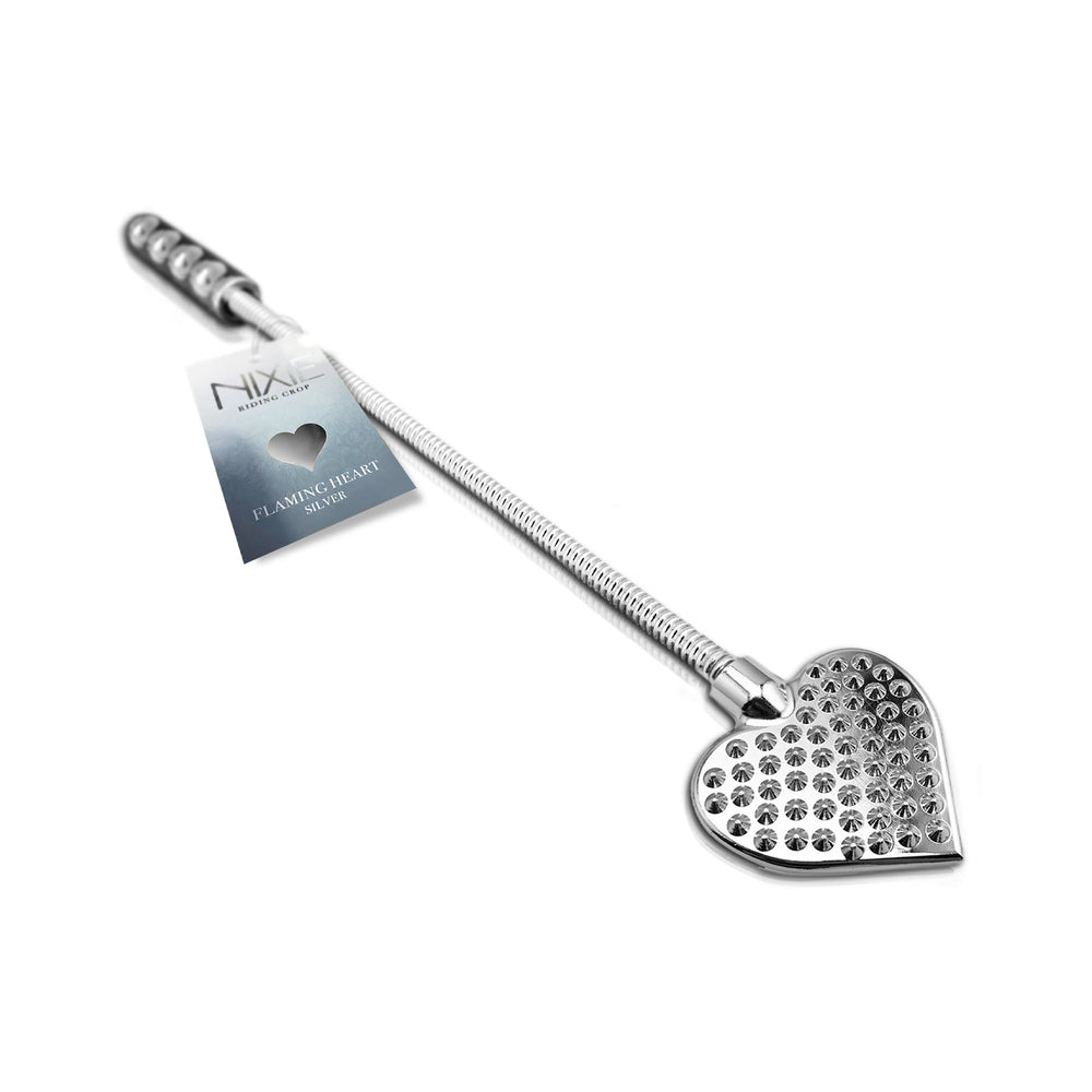 Nixie Metal Riding Crop Flaming Heart with flexible metal shaft and weighted heart tip against black backdrop.