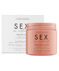 Bijoux Indiscrets Sex au Naturel Orgasm Glow Supplement 60 capsules bottle on a soft lit nightstand next to a rose petal.