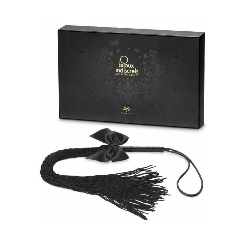Bijoux Indiscrets Lilly Fringe Whip with dozens of soft synthetic tassels cascading elegantly against a dark