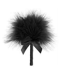 Bijoux Indiscrets Tickle Me Tickler - pink feather tickler resting on silk sheets