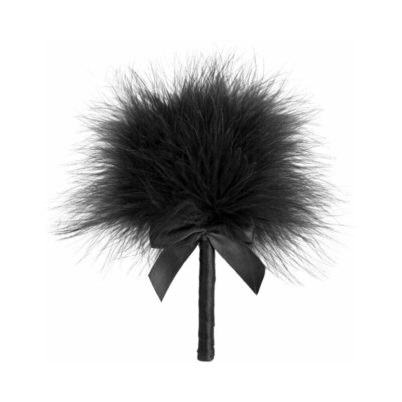 Bijoux Indiscrets Tickle Me Tickler - pink feather tickler resting on silk sheets