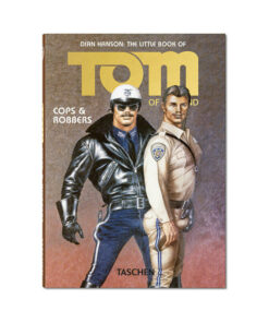 Tom of Finland Cops & Robbers Pocket Edition hardcover book lying open on a dark surface