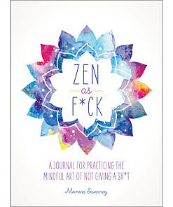 Zen as F*ck Journal open on a desk with vibrant cover art and profanity-laced prompts