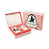 Truth or Dare: A Game of Passion card deck in a hinged box with dice on a romantic evening table setting.
