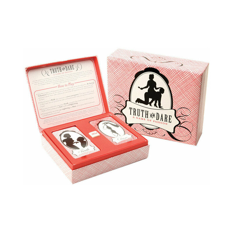 Truth or Dare: A Game of Passion card deck in a hinged box with dice on a romantic evening table setting.