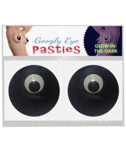 Glow-in-the-Dark Googly Eye Pasties glowing green on skin in a dimly lit bedroom