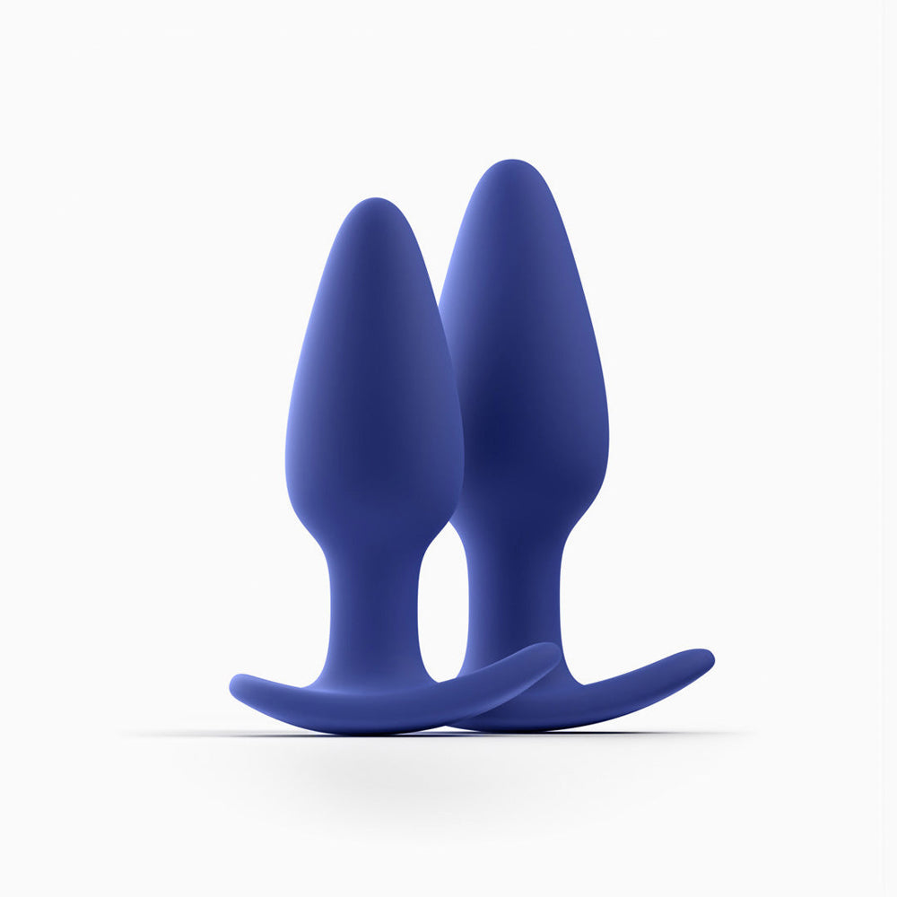 Two blue Biird Regii anal plugs on a white background
