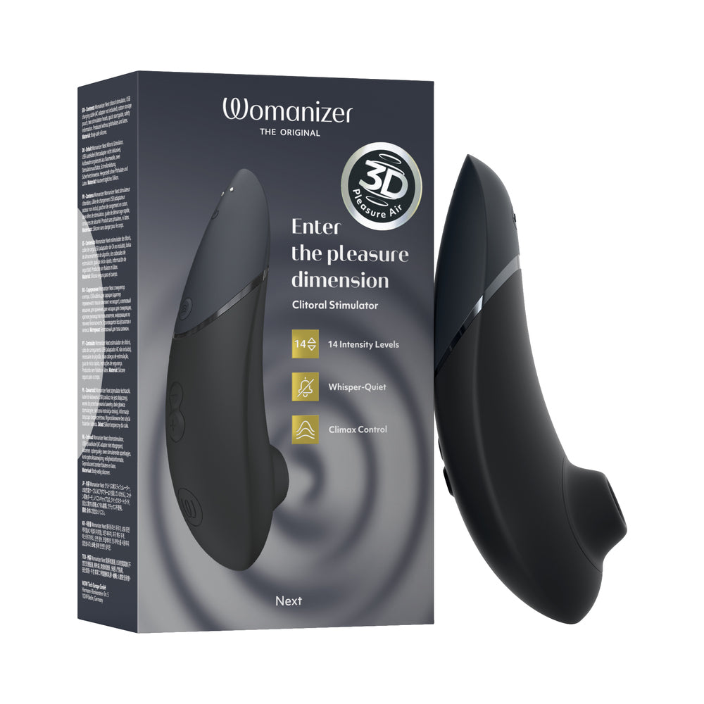 Womanizer Next Black device with soft silicone head on neutral background