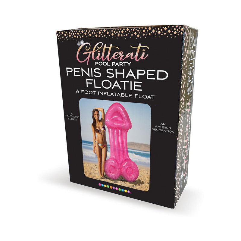 Pink 6-foot Glitterati penis-shaped pool float floating in a sunlit pool with party guests laughing in the background