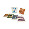 Kheper Games 40 Reasons to Party Cards fanned out on a table with mixed drinks and colorful party lights.