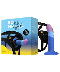 ROMP Piccolo pegging kit with soft purple silicone dildo and black adjustable harness shown on white background.
