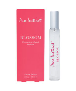 Pure Instinct Pheromone Perfume Spray Blossom 0.31 oz on white backdrop with soft pink floral petals.