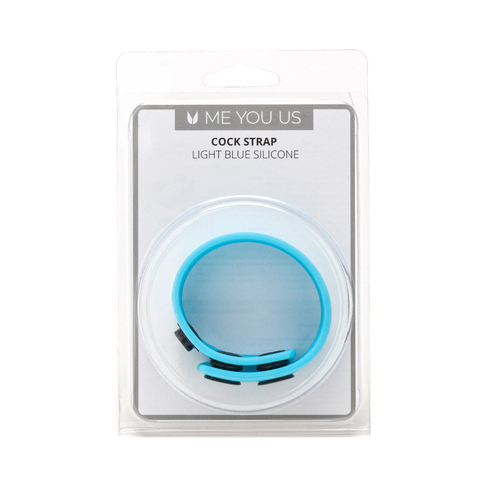 Me You Us Light Blue Silicone Cock Strap laid on a white surface
