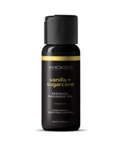 Wicked Vanilla and Sugarcane Massage Oil 4 oz bottle on spa setting with vanilla beans and sugarcane.