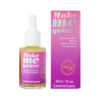 Love to Love Make Me Quiver Clitoral Arousal Serum 1 oz bottle on vanity with soft pink lighting.