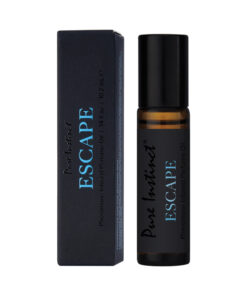 Rollerball bottle of Pure Instinct Pheromone Perfume Oil Escape with amber liquid and sleek black cap on a white background.