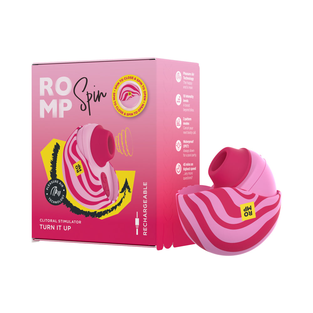ROMP Spin travel rechargeable clitoral stimulator held in hand with its protective cover open