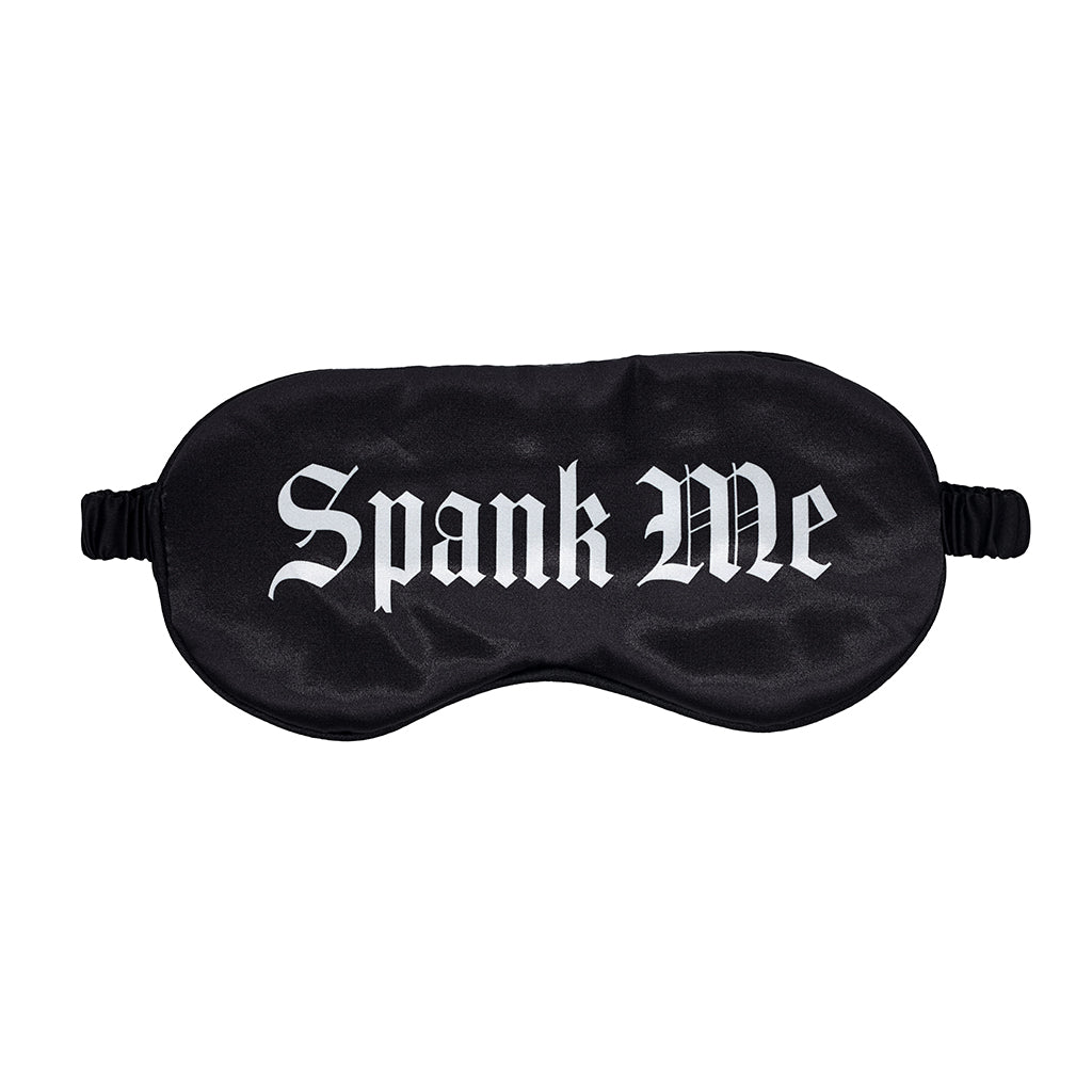 Ouch! Spank Me Printed Mask in satin black with bold white text lettering and elastic strap on a neutral background