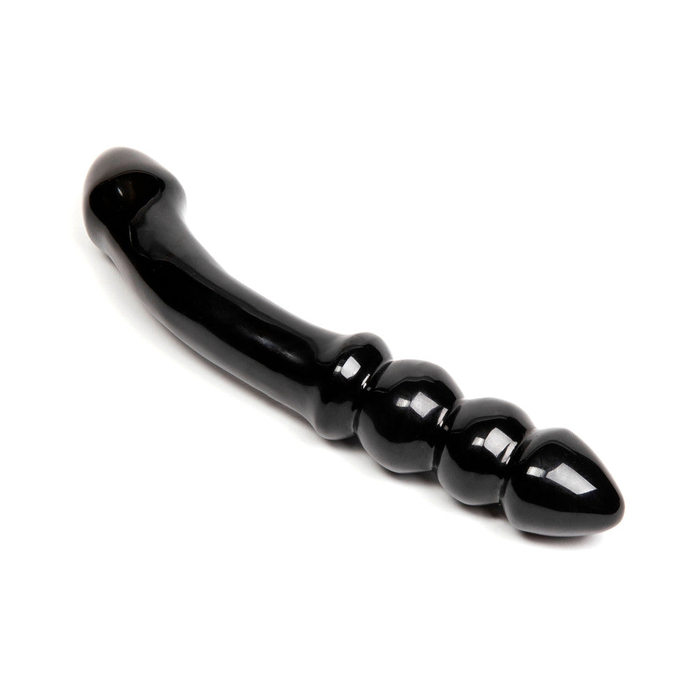Chakrubs Xaga Viper Obsidian Wand black obsidian crystal with curved ridged shape on dark surface