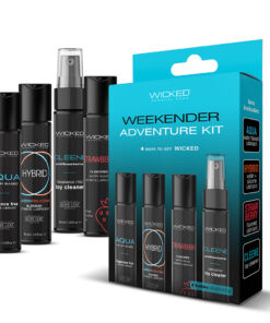 Wicked Weekender Adventure Kit travel-sized lubricants and toy cleaner arranged on hotel nightstand.