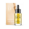 Bijoux Indiscrets anal soothing oil bottle on a soft silk background with a few drops glistening.