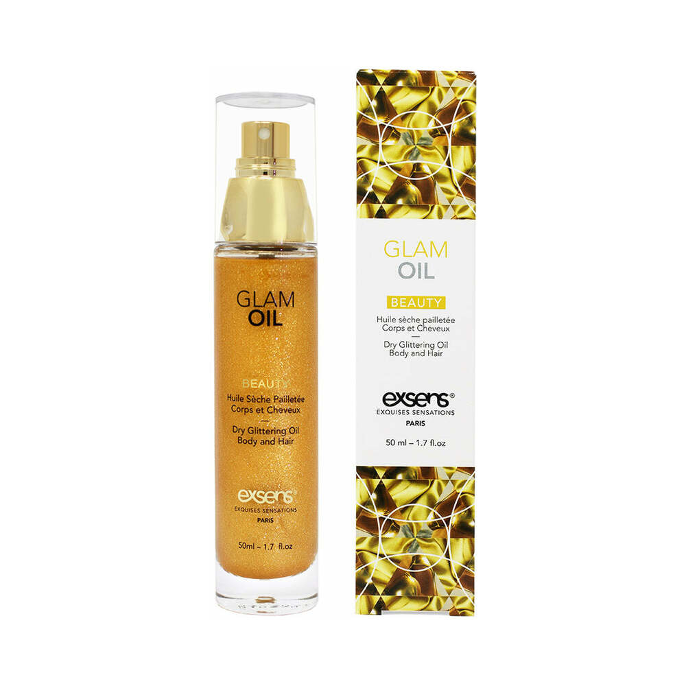 Exsens Glam Oil 1.7 oz. bottle next to a golden shimmer drop on skin