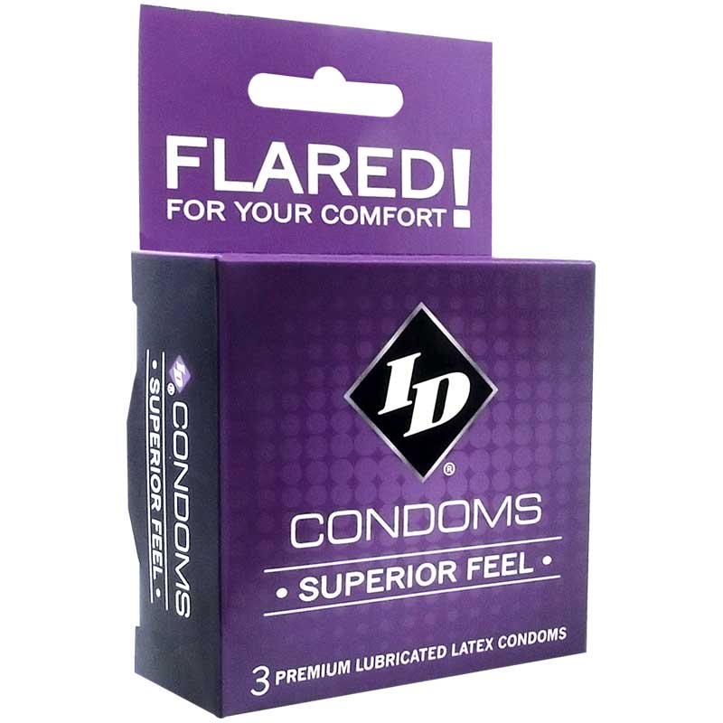 ID Superior Feel Condom three-pack with clear latex condoms and foil wrappers on a soft bedside surface