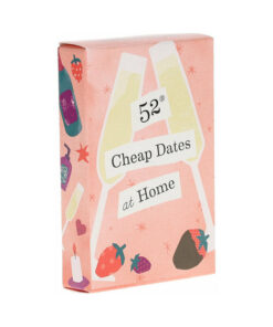 Compact deck of 52 Cheap Dates at Home Cards fanned out on a cozy sofa